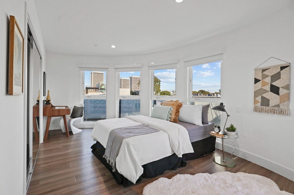 Master Bedroom with Lots of Windows and Vinyl Flooring