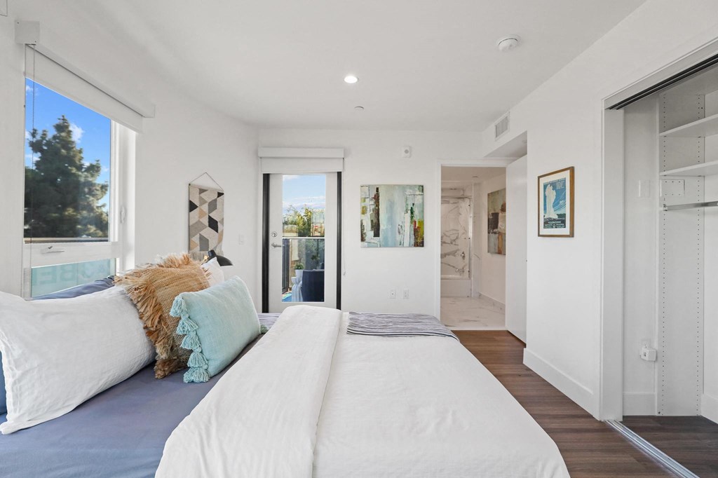 Bedroom with Patio Access and Lots of Windows