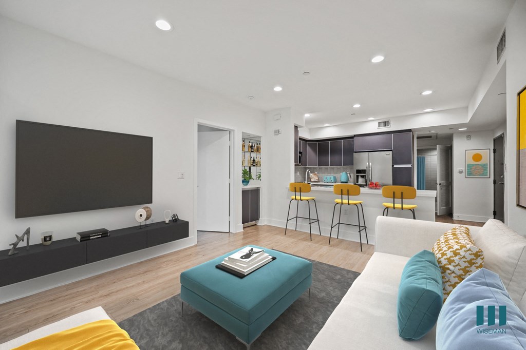 Open-Concept Kitchen with Countertop Bar and Living Room