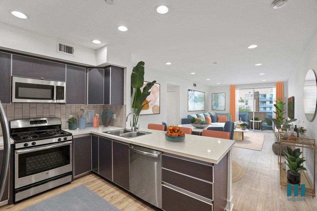 Open-Concept Kitchen, Dining, and Living Room with Patio