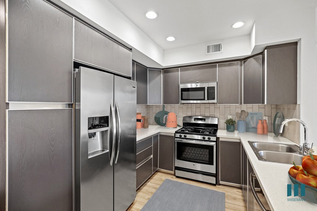 Full-Size Kitchen with Stainless Steel Refrigerator, Stove, Microwave Oven, and Dishwasher