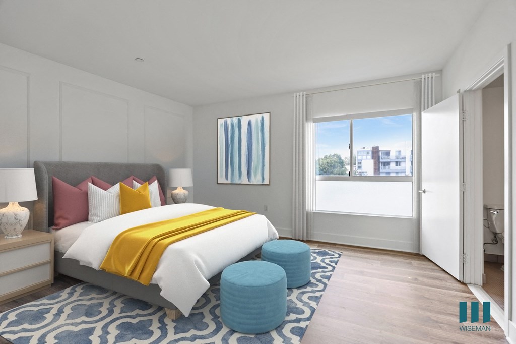 Spacious Bedroom with Large Windows, Vinyl Flooring, and Bathroom