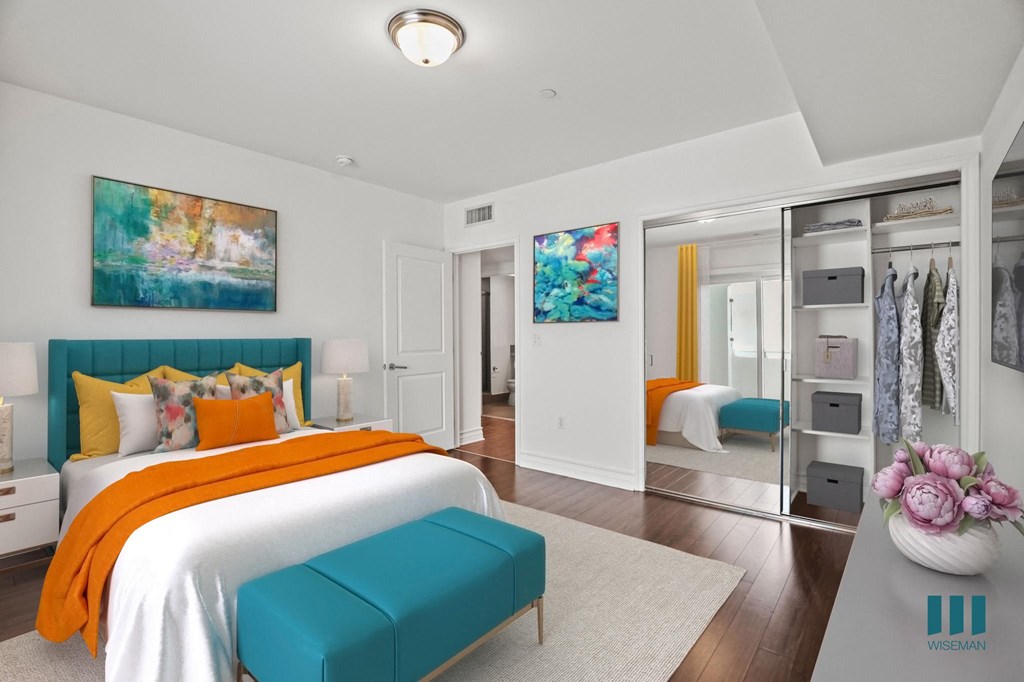 Bedroom with Vinyl Flooring, and Mirrored Closet with Shelving