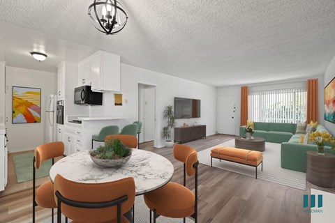 A modern living room with a dining table and chairs.