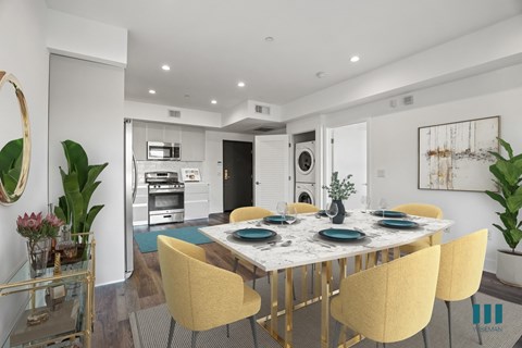 a dining room with a marble table and yellow chairs