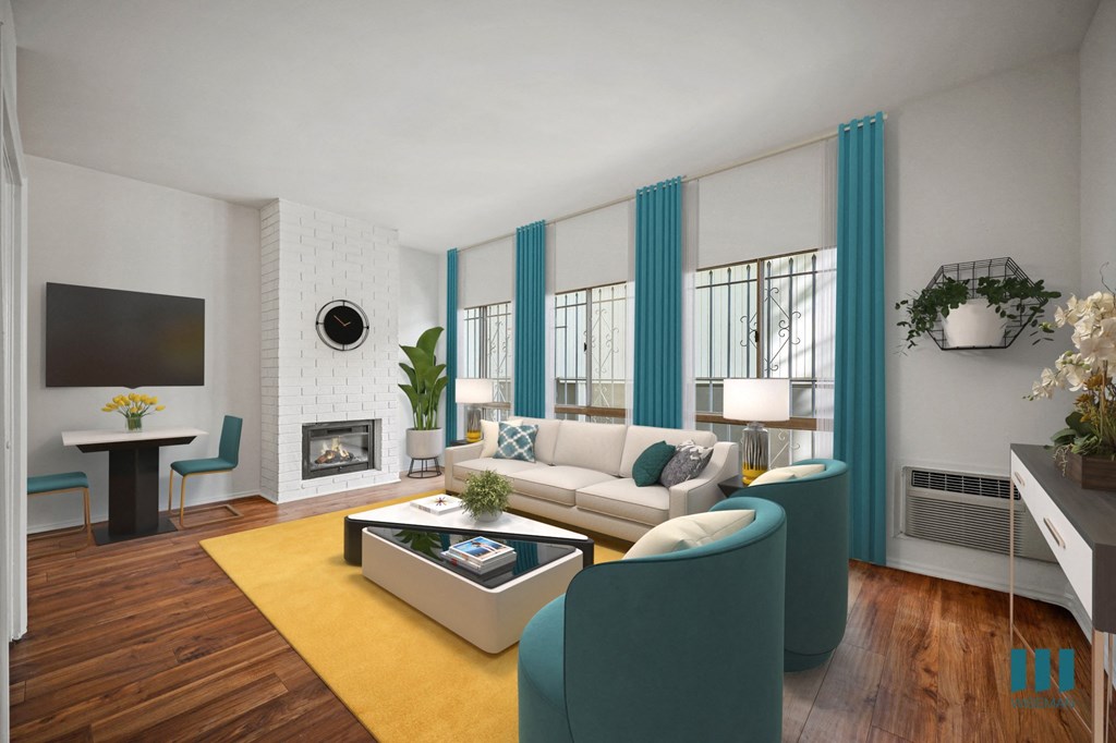 A modern living room with a white sofa, a coffee table, and a fireplace.