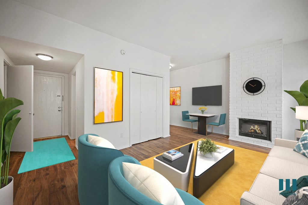 A modern living room with a fireplace and a painting on the wall.