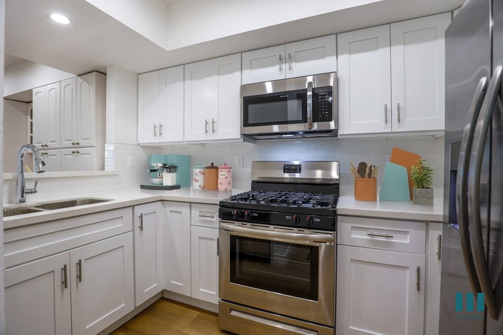 Kitchen with Energy-Efficient Appliances and Ample Cabinet Storage