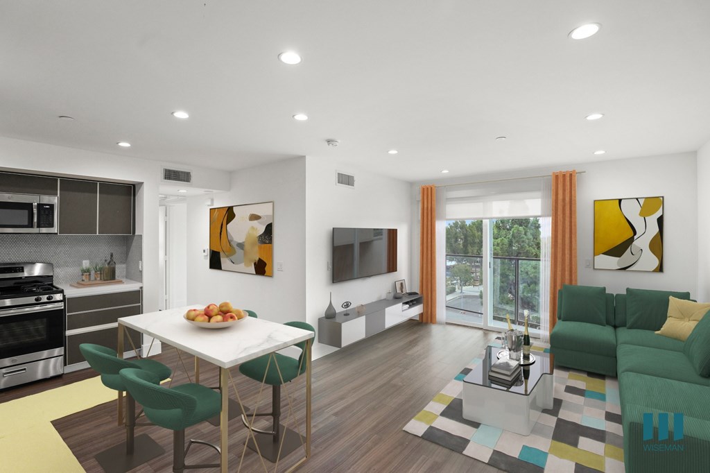 Open-Concept Kitchen, Dining, and Living Room Space with a Patio