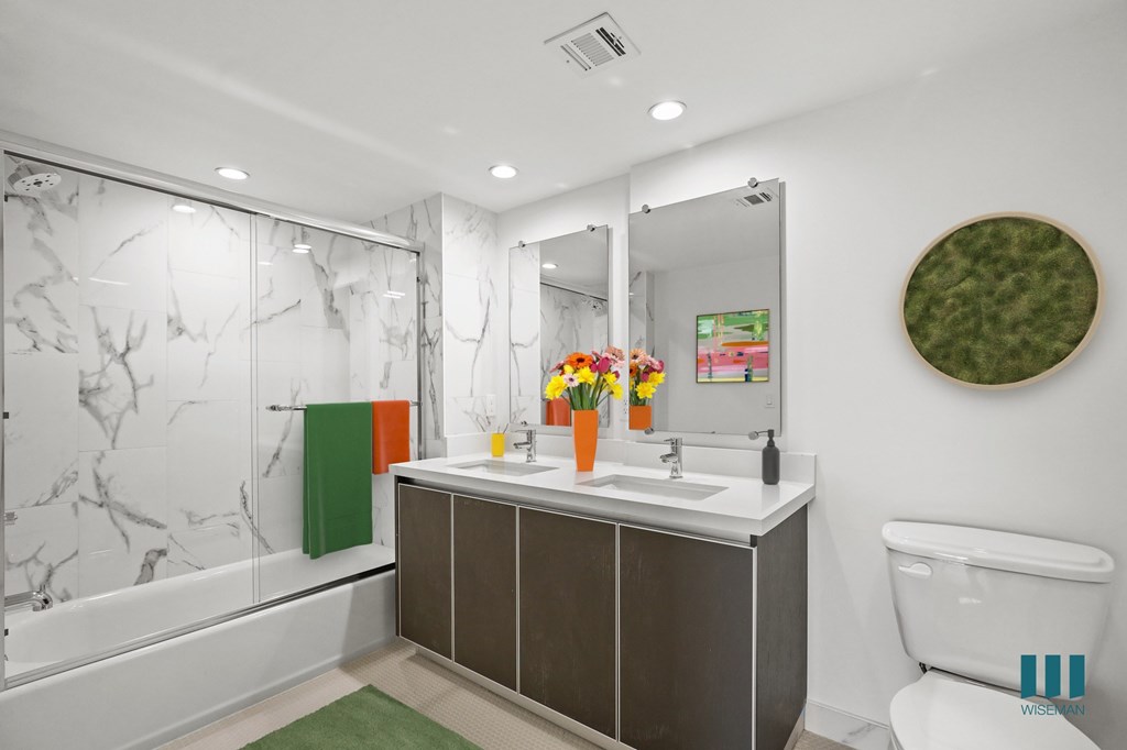 Large-Size Bathroom with Shower-Bath with a Glass Door and Vanity Cabinet Storage