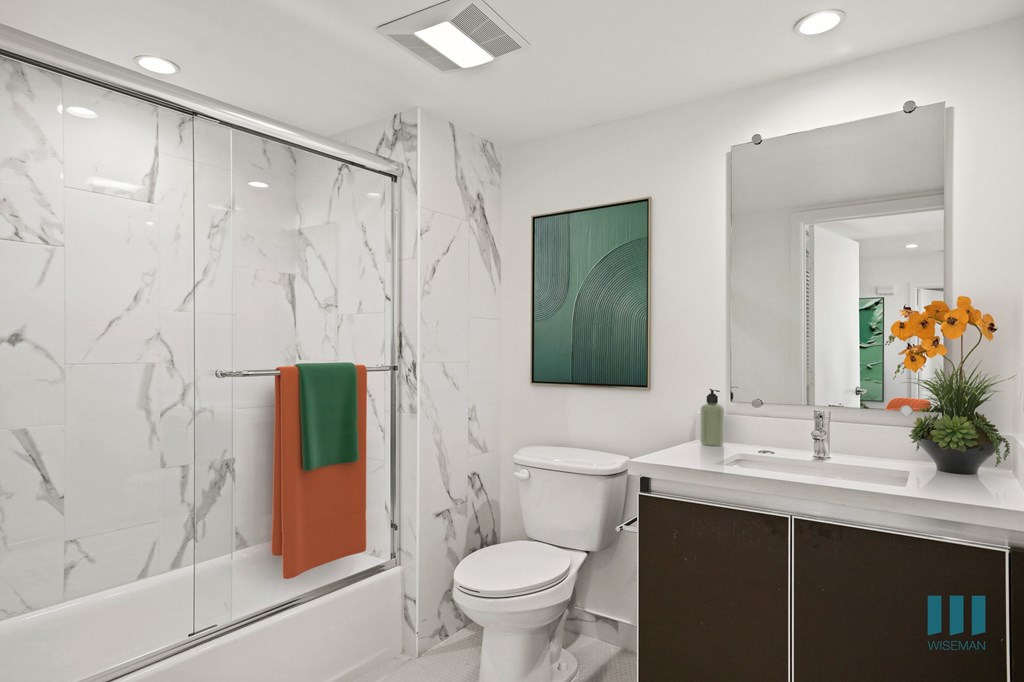 Bathroom with Shower-Bath with a Glass Door and Vanity Cabinet Storage