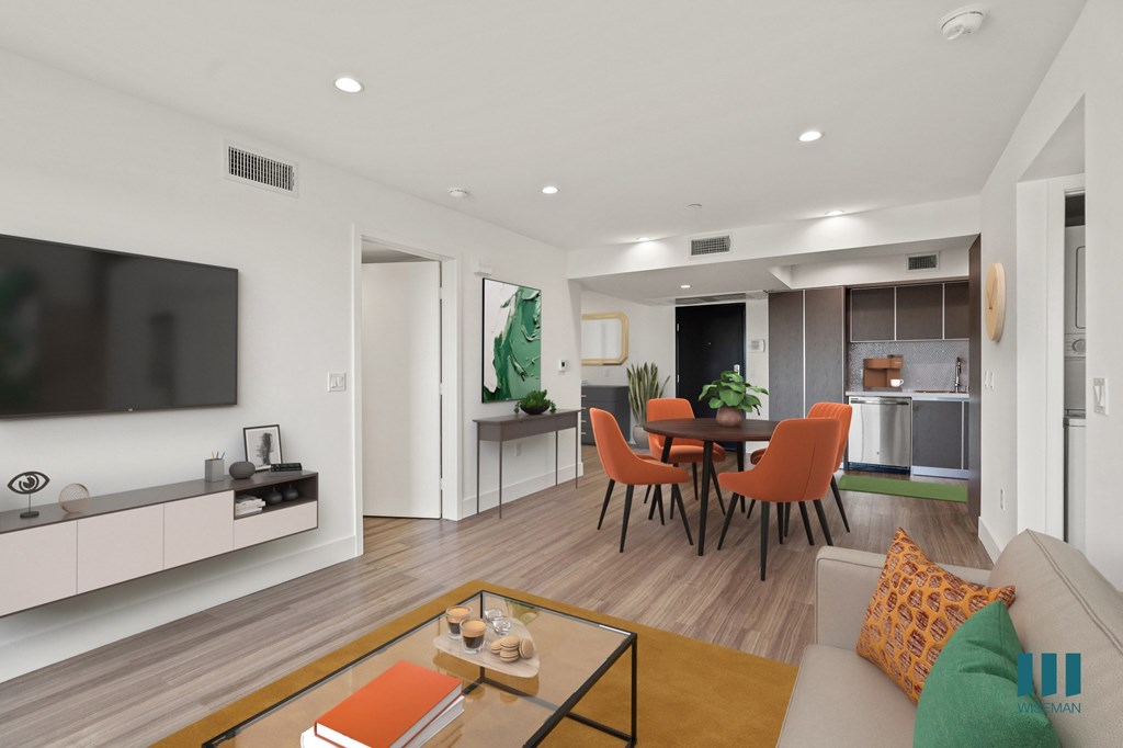 Open-Concept Kitchen, Dining, and Living Room Space with Vinyl Flooring and Recessed Lighting
