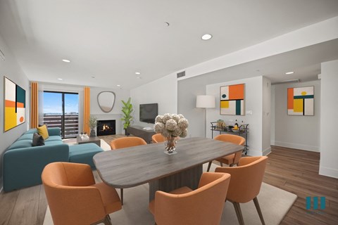Open-Concept Dining and Living Room with Vinyl Flooring, Recessed Lighting, Electric Fireplace, and Patio