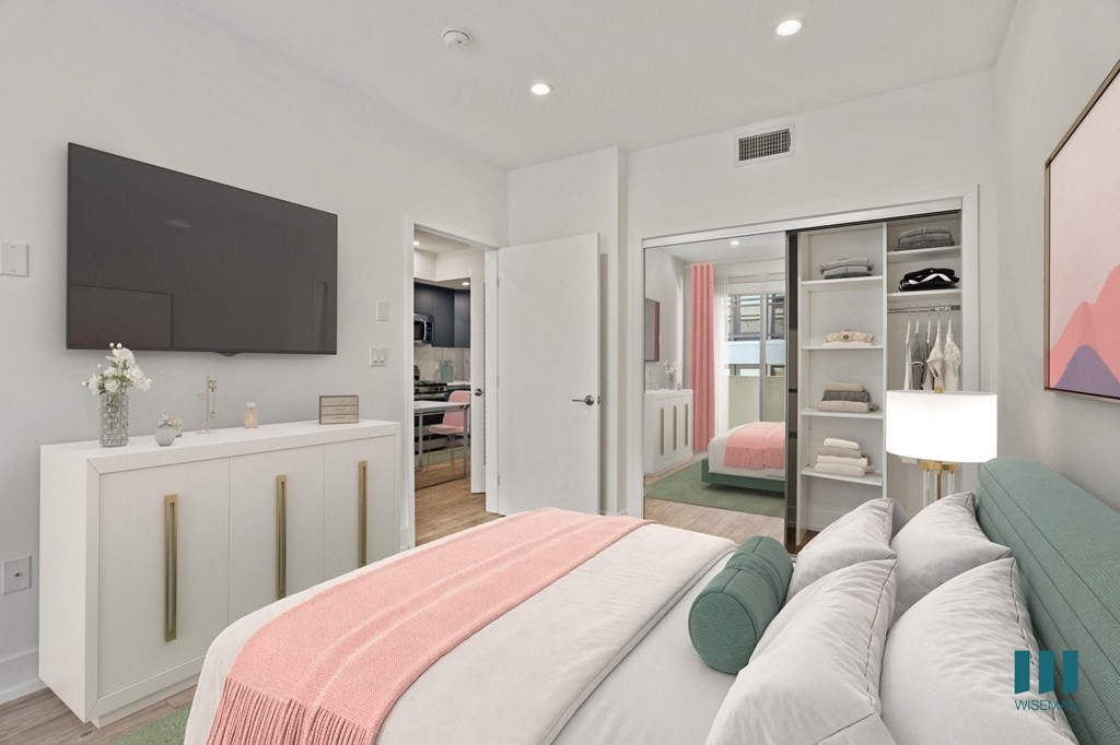 Bedroom with Mirrored Closet with Built-In Shelving