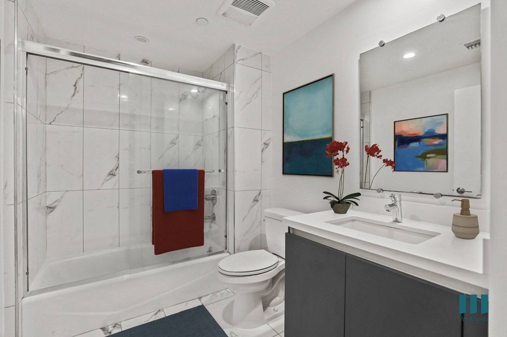 Bathroom with Shower Bath with Glass Door and Vanity Cabinet Storage