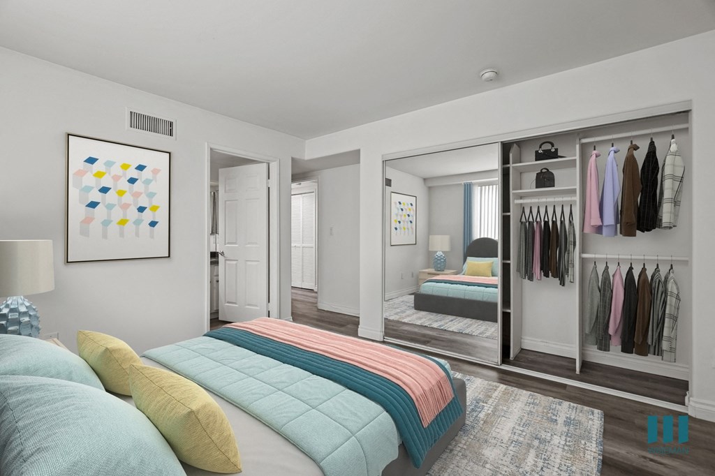Bedroom with Mirrored Closet, Vinyl Flooring, and Bathroom