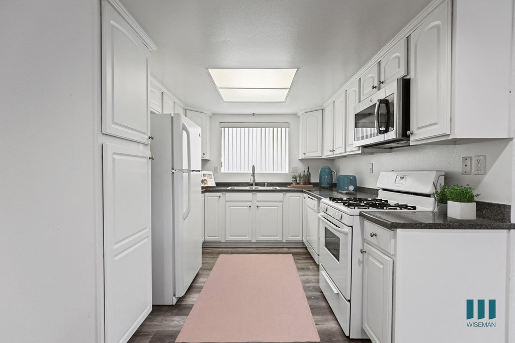 Full-Size Kitchen with Refrigerator, Stove, Dishwasher, and Microwave Oven