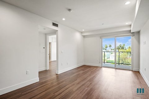 Living Room Area with Vinyl Flooring, Recessed Lighting, and a Patio