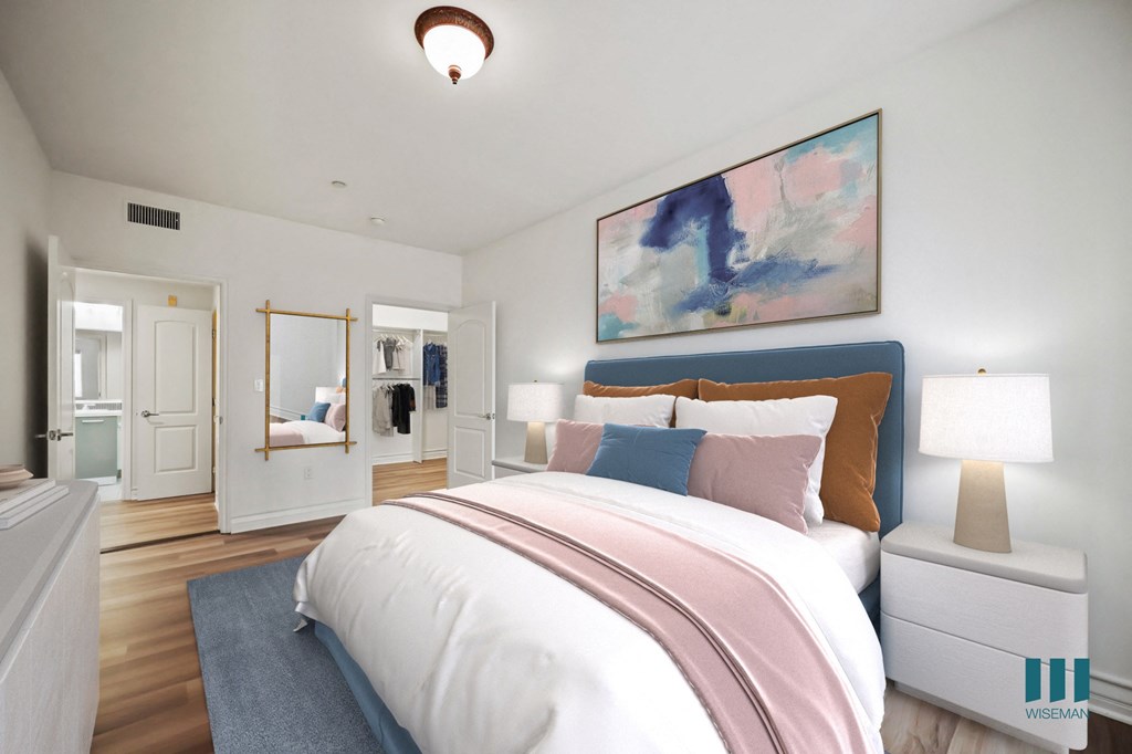 Bedroom with Walk-In Closet with Built-In Organizers and Bathroom