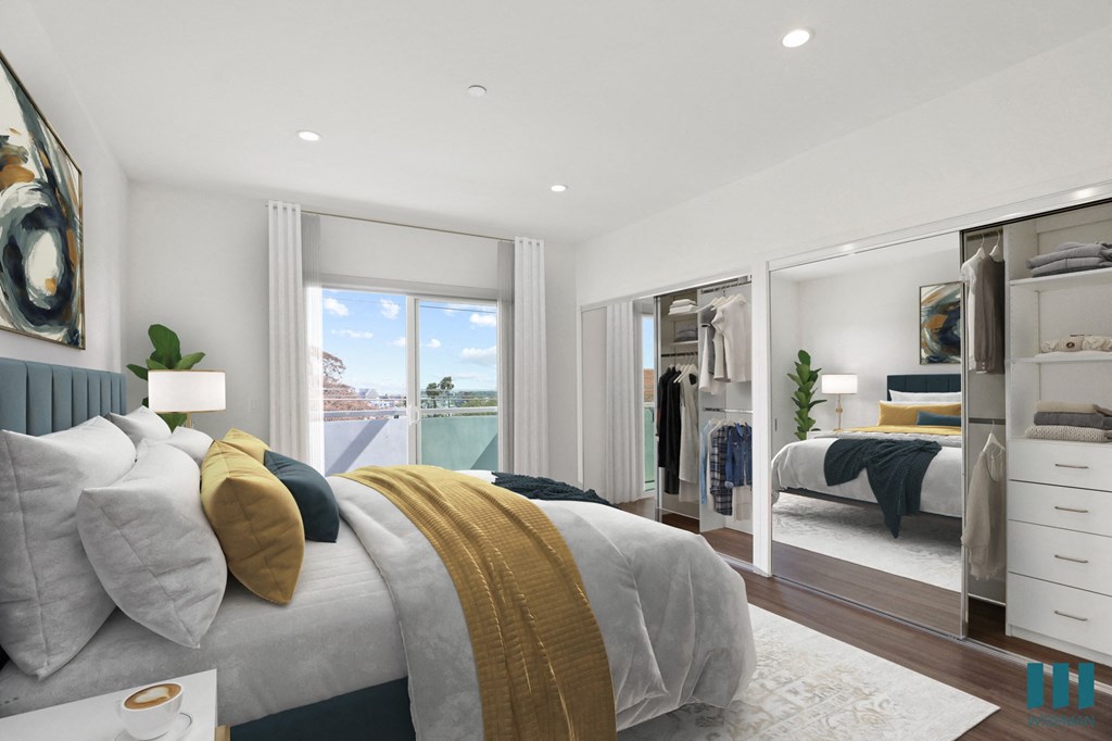 Bedroom with Mirrored Closet , Patio, and Vinyl Flooring