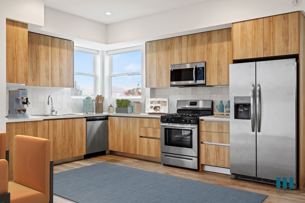 a kitchen with stainless steel appliances and wooden cabinets
