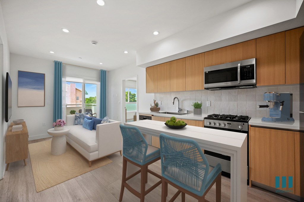 A modern kitchen with a white countertop and blue chairs.