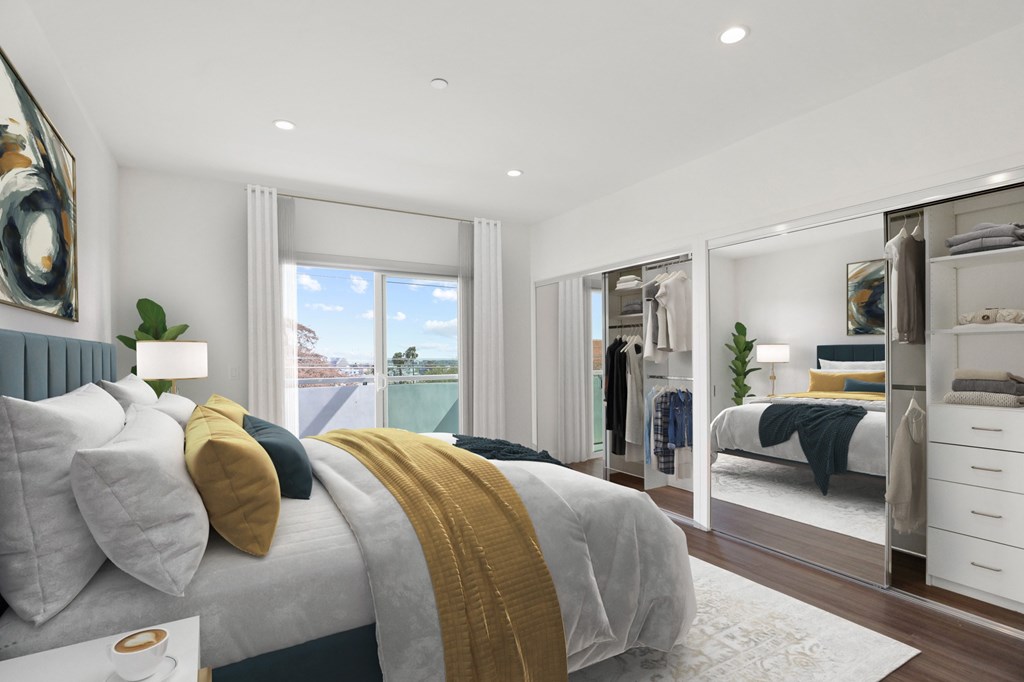 Bedroom with Two Mirrored Closets with Built-In Organizers, Vinyl Flooring, Recessed Lighting, and Balcony with Custom Shades