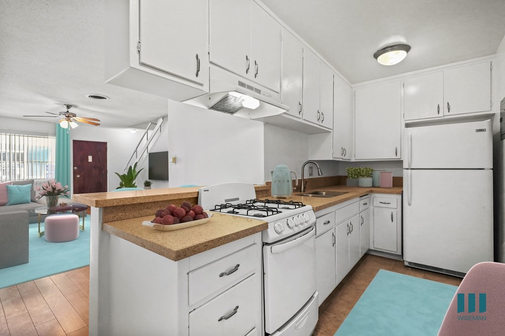 Kitchen with a Stove Oven, Refrigerator, and Ample Cabinet Storage