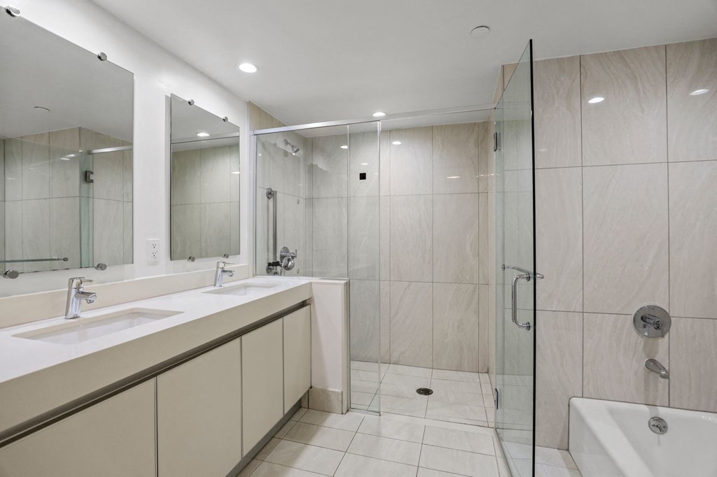 Master Bathroom with Walk-In Shower, Bathtub, and Double-Sink Vanity with Cabinet Storage