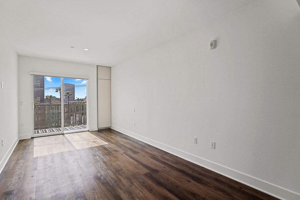Living Room with Vinyl Flooring, Recessed Lighting, and Patio