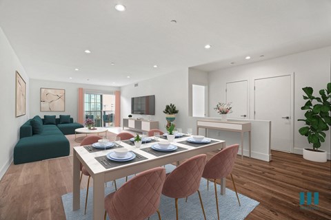 a living room and dining room with a table and chairs