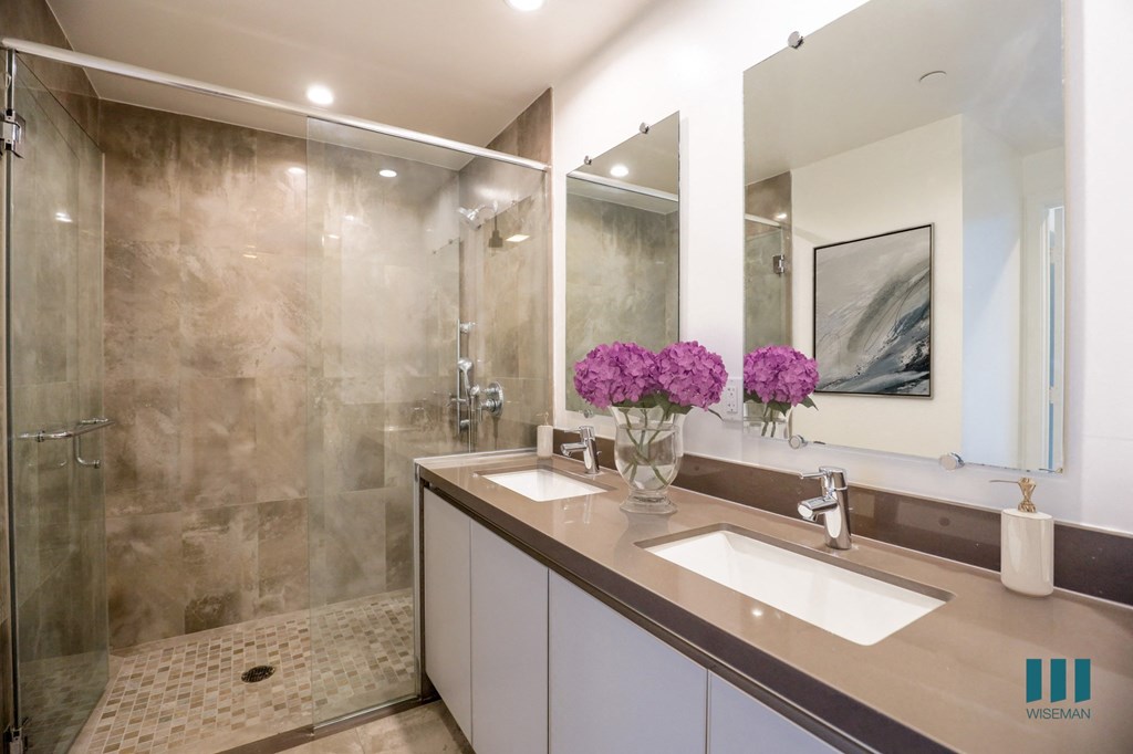 Large-Size Bathroom with Walk-In Shower, Dual-Sinks, and Vanity Cabinet Storage