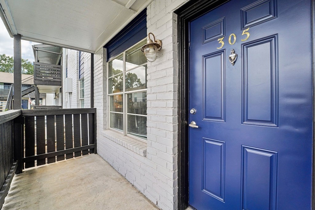 A blue door with the number 305 on it.