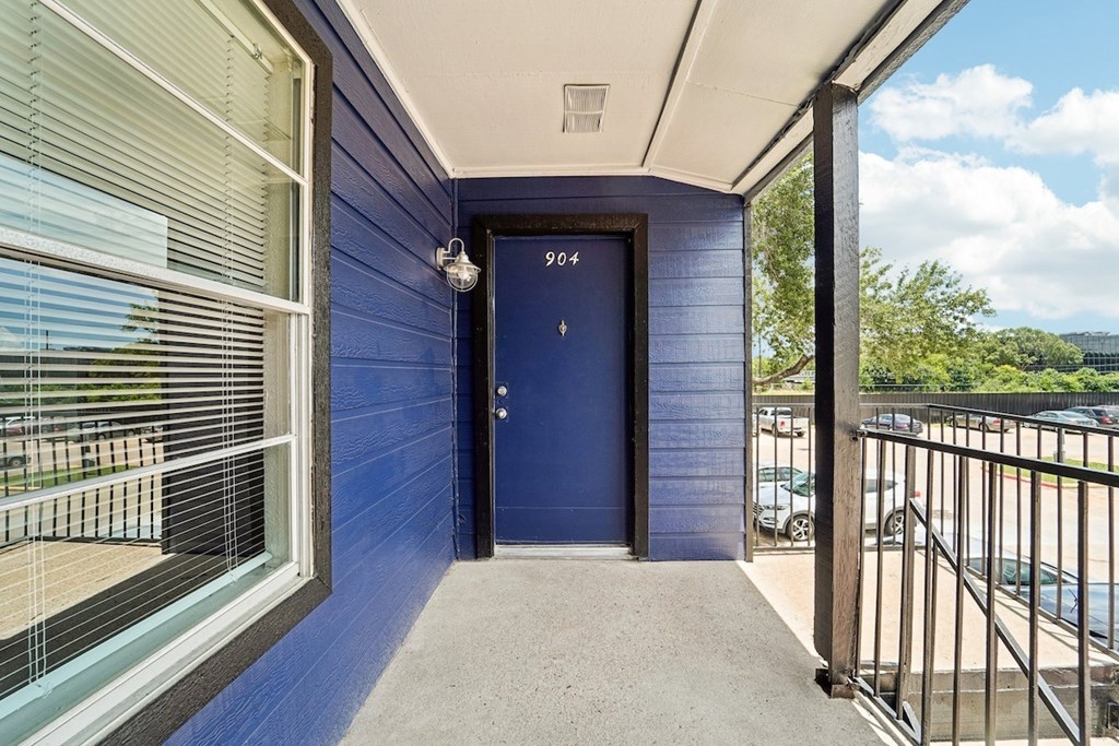 A blue door with the number 904 on it.