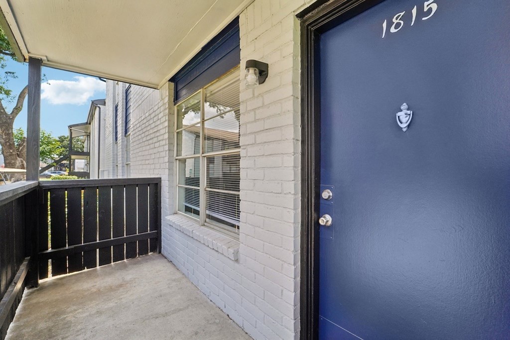 A blue door with a number 1815 on it.