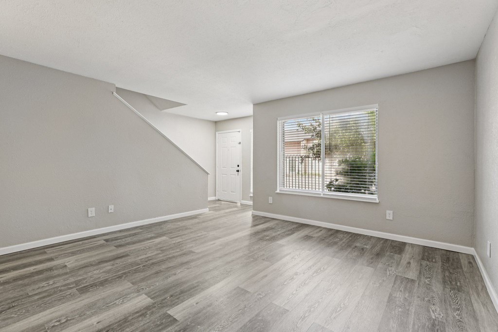 A room with a window and a door.