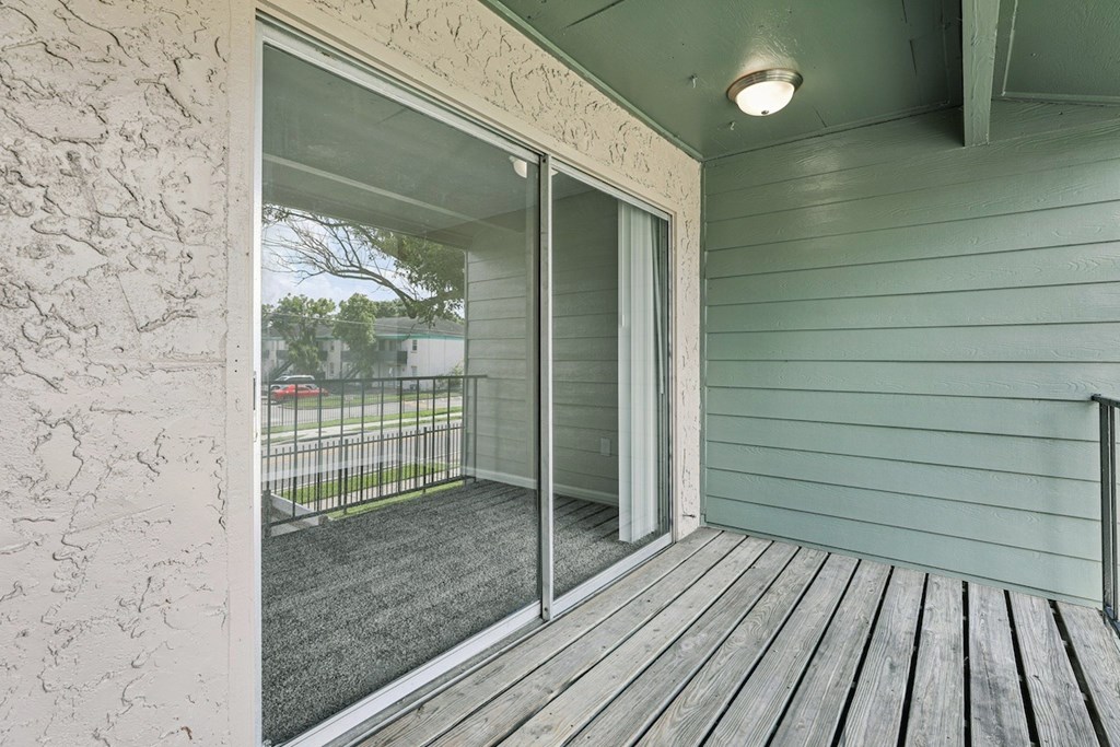 A sliding glass door opens to a deck.