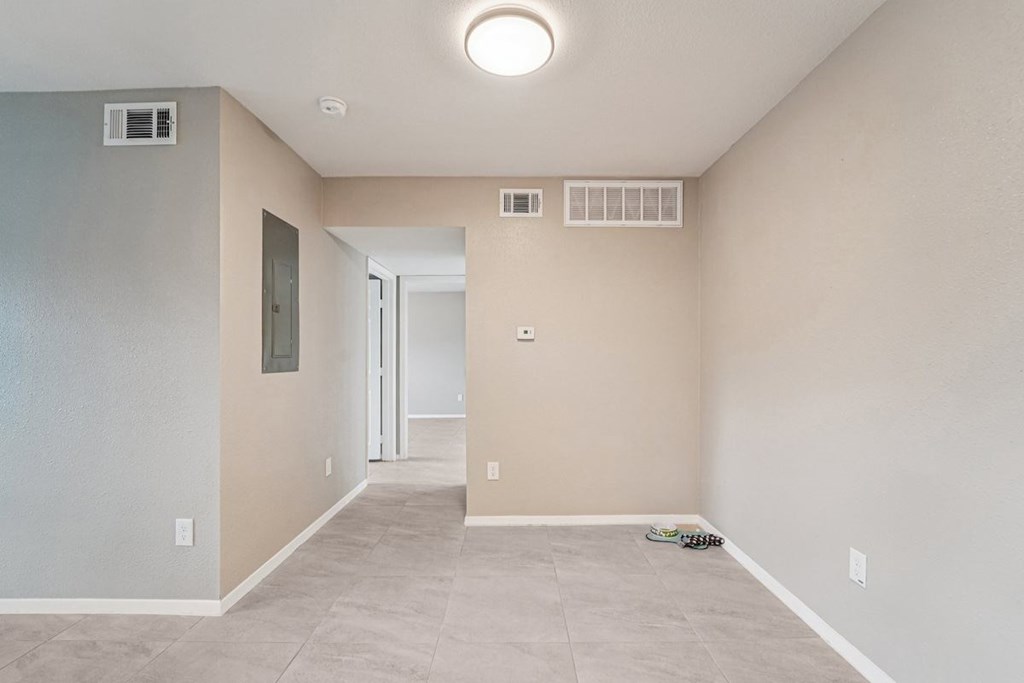 A room with a doorway leading to another room.