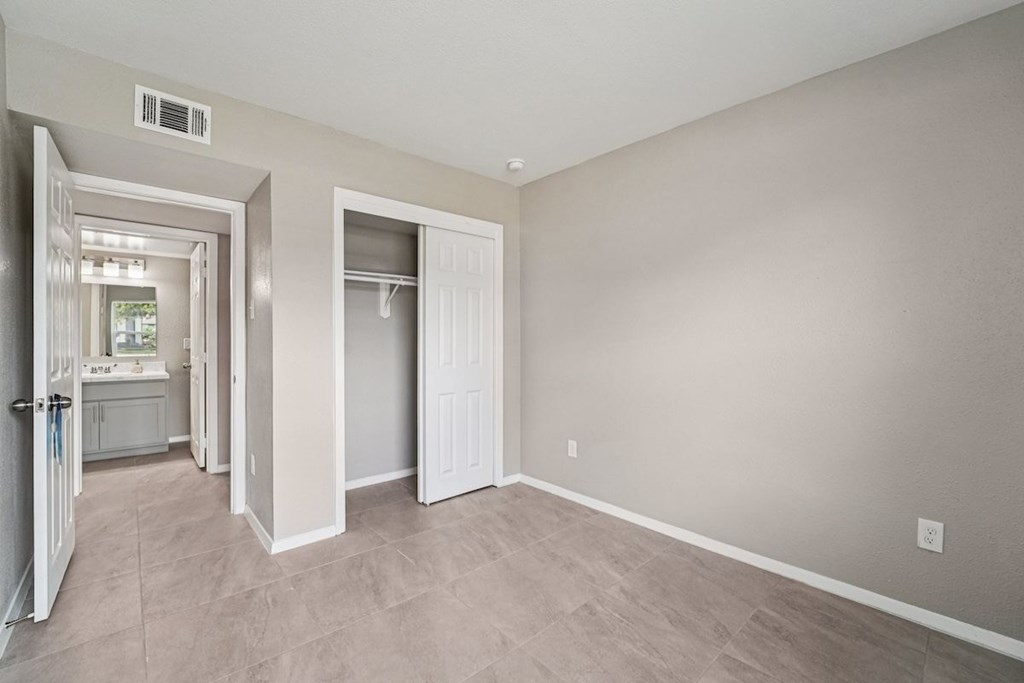 A room with a white door and a window.