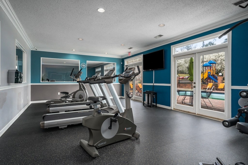the gym at the landing has a view of the pool and playground at Ascot Place Apartments, Alabama, 35235