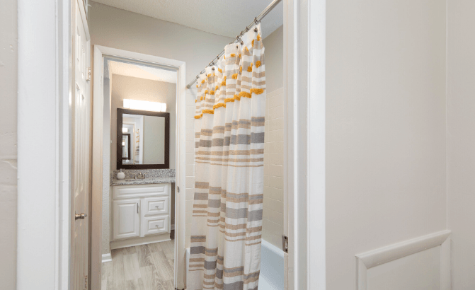 a bathroom with a shower and a sink at Crestwood Green, LLC, Birmingham, AL