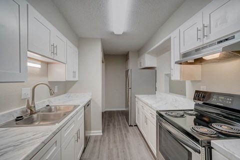 a modern renovated kitchen at Hills at Hoover Apartments