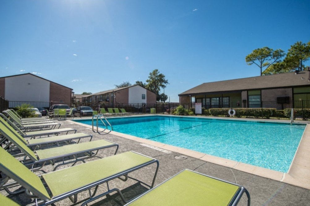 our apartments have a large pool and lounge chairs