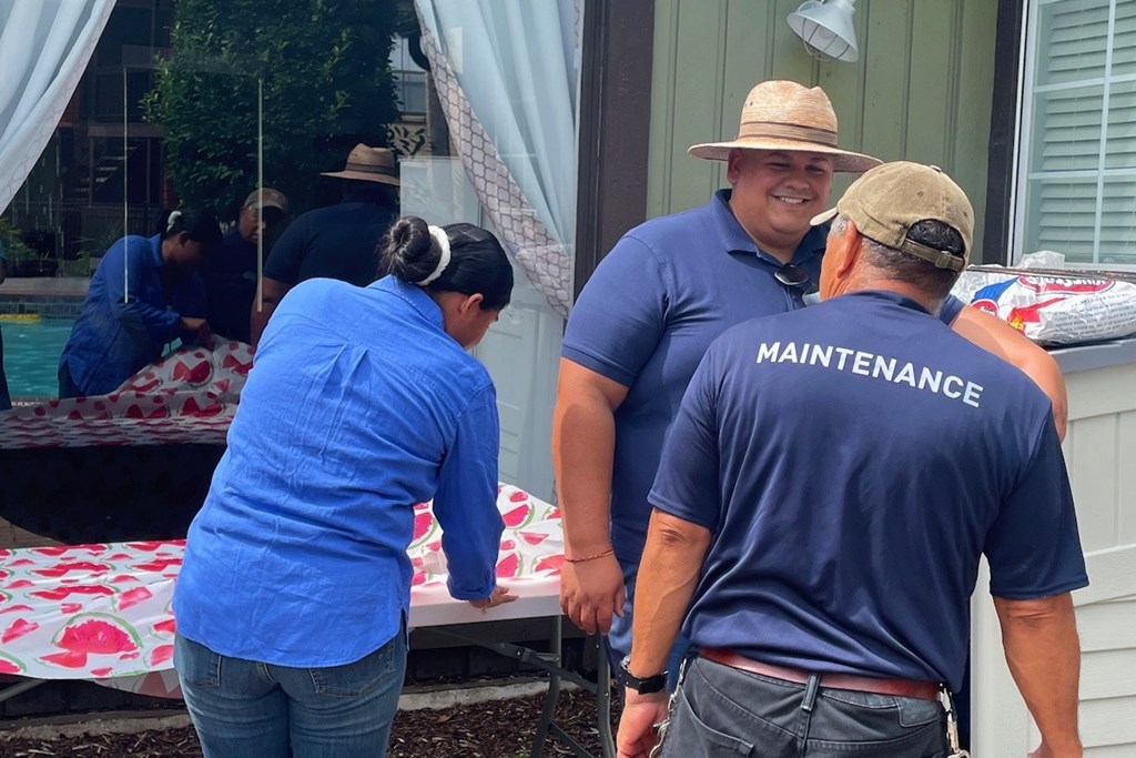 A man in a blue shirt with the word