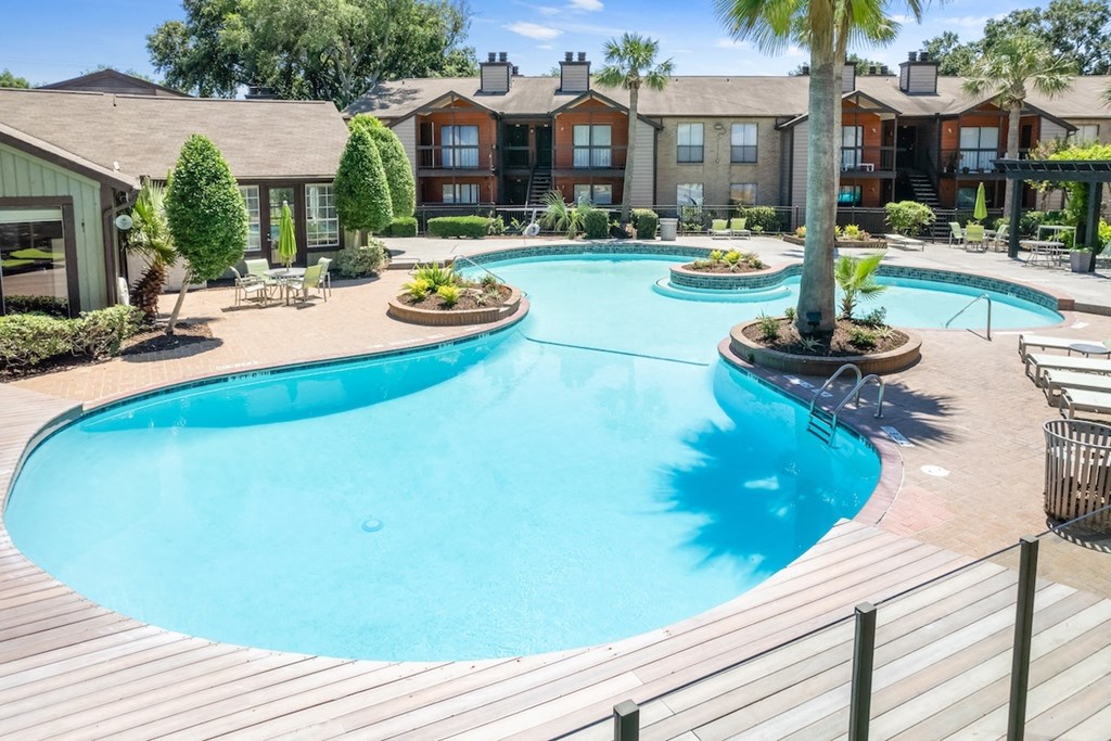 a lagoon style swimming pool at Hudson at Westchase Apartments in Houston