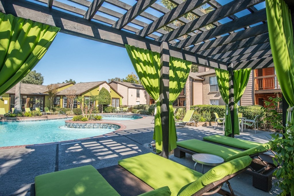 a resort-style cabana around a lagoon-inspired pool at Hudson at Westchase Apartments