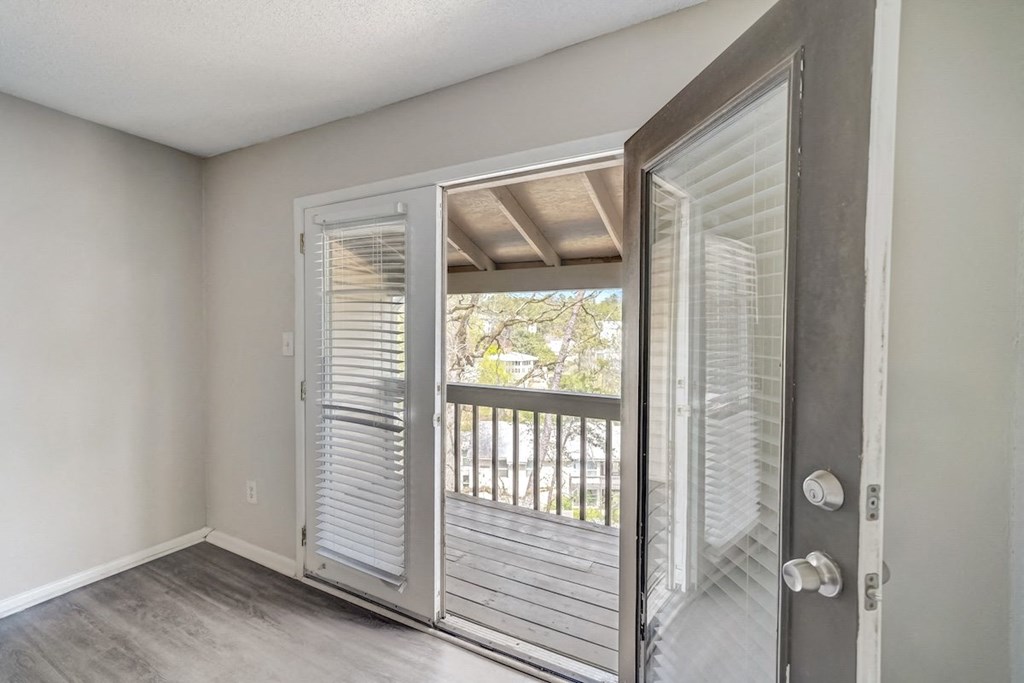 French doors from a living room to a private deck at Hills at Hoover 35216