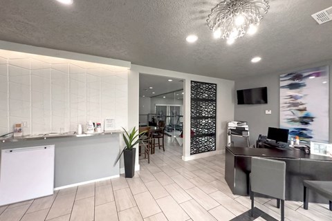 a kitchen and dining room with a table and chairs