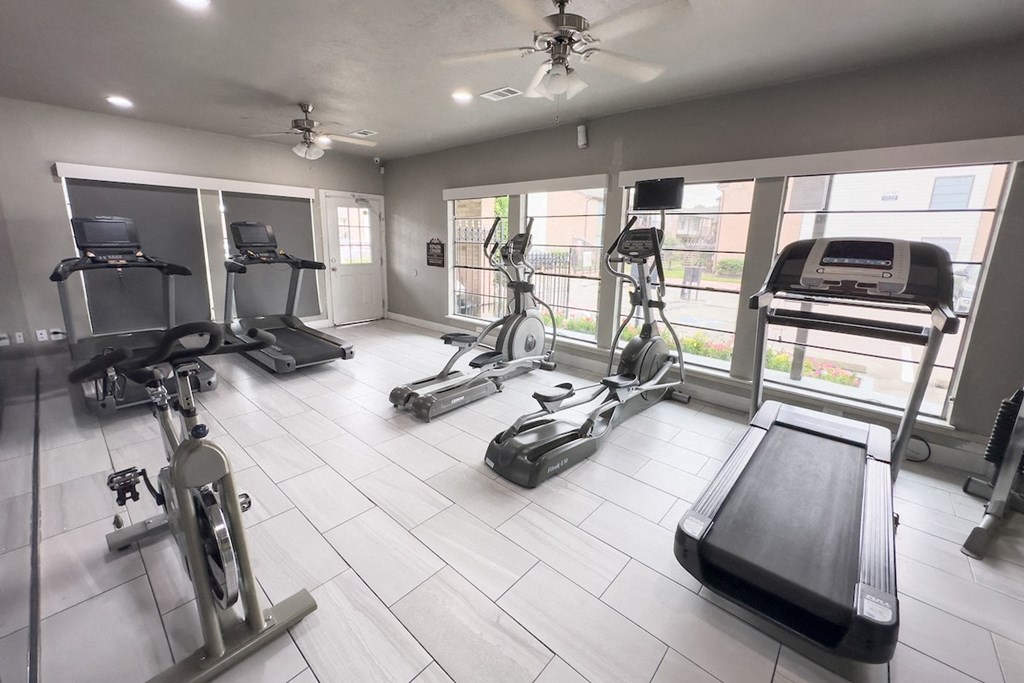 a fully equipped fitness center at Crosby at Westchase Apartments for rent in Houston, Texas