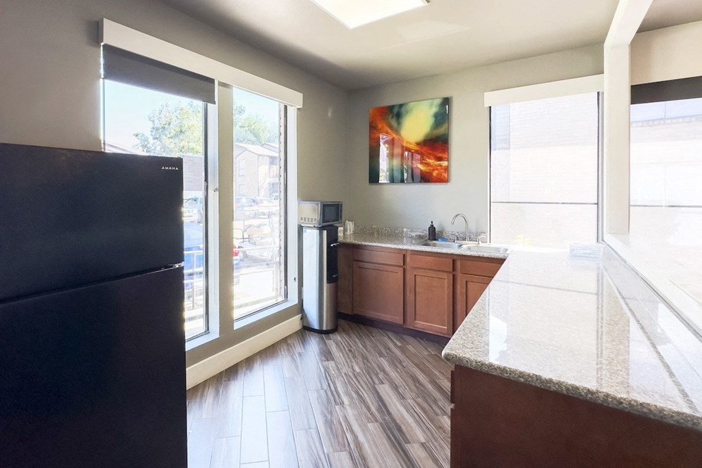 a kitchen area in the resident clubhouse at Hudson at Westchase Apartments in Houston, Texas